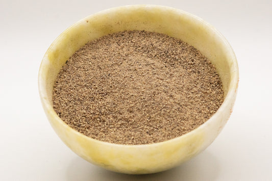 Peppercorns - white, freshly ground.